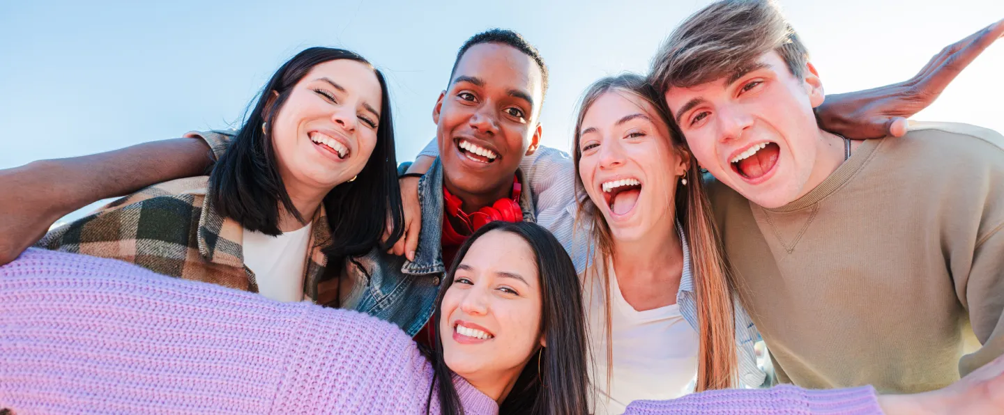 Happy group of young people smiling together
